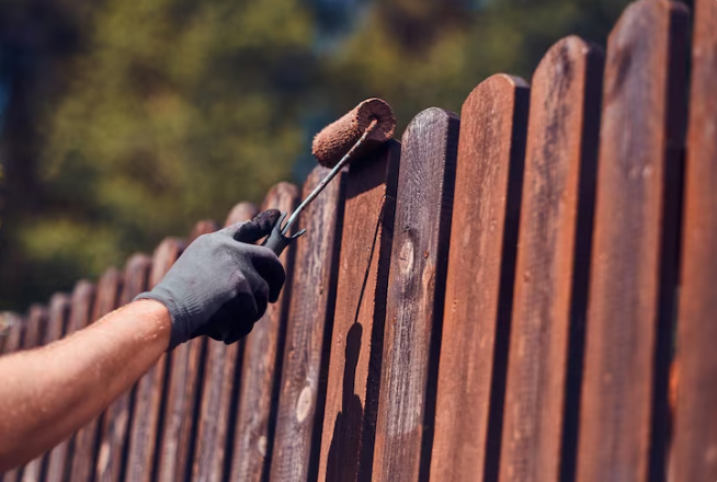 Combining Fence Installation and Staining for Stronger Protection and Lasting Results
